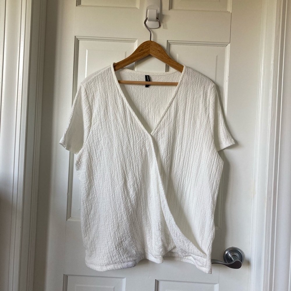 White wraparound short sleeved top